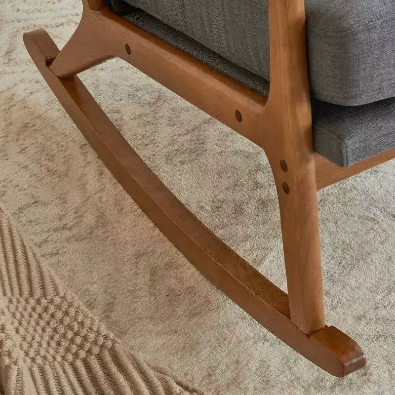 Fauteuil à bascule gris rembourré