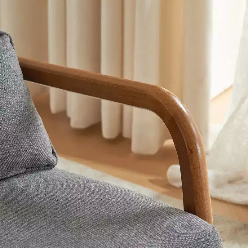 Fauteuil à bascule gris rembourré